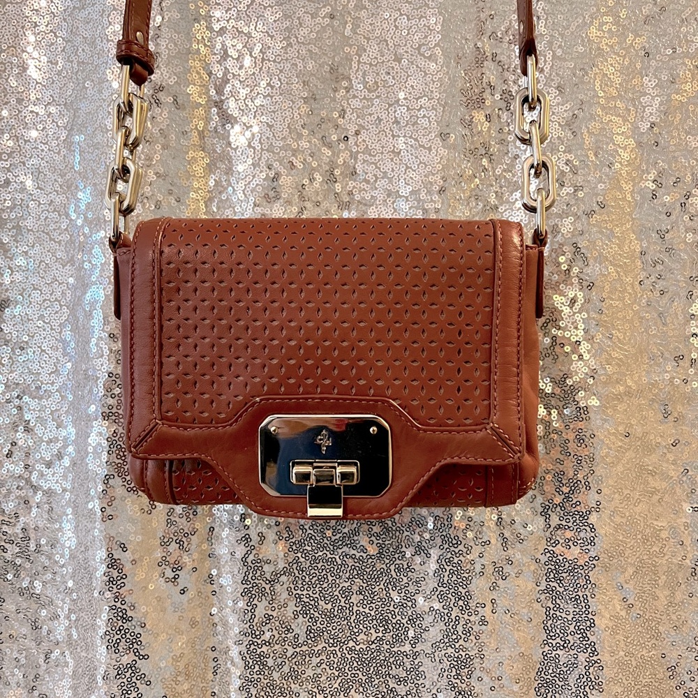 Cole Haan Perforated leather cross body handbag in Equestrian Tan